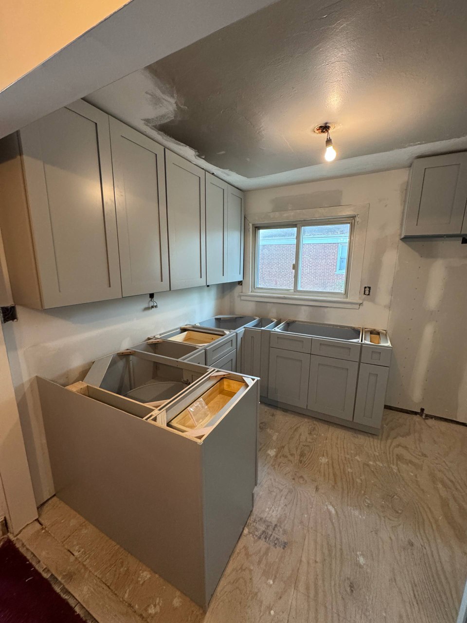 Modern White Kitchen with Herringbone Floors - Detail 1